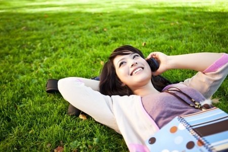 Girl talking on the phone in the park